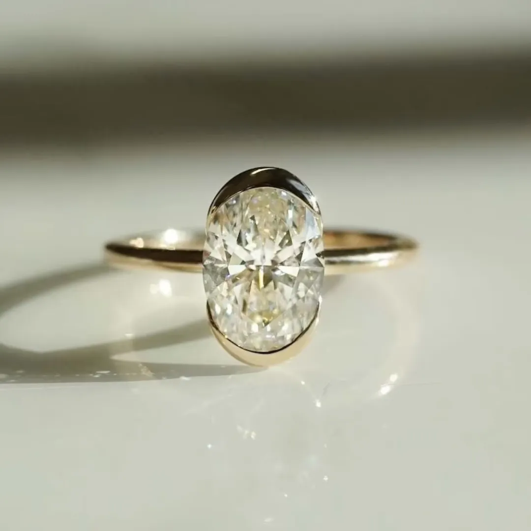 /public/photos/live/Oval Cut Half Bezel Set Moissanite Engagement Ring 725 (1).webp